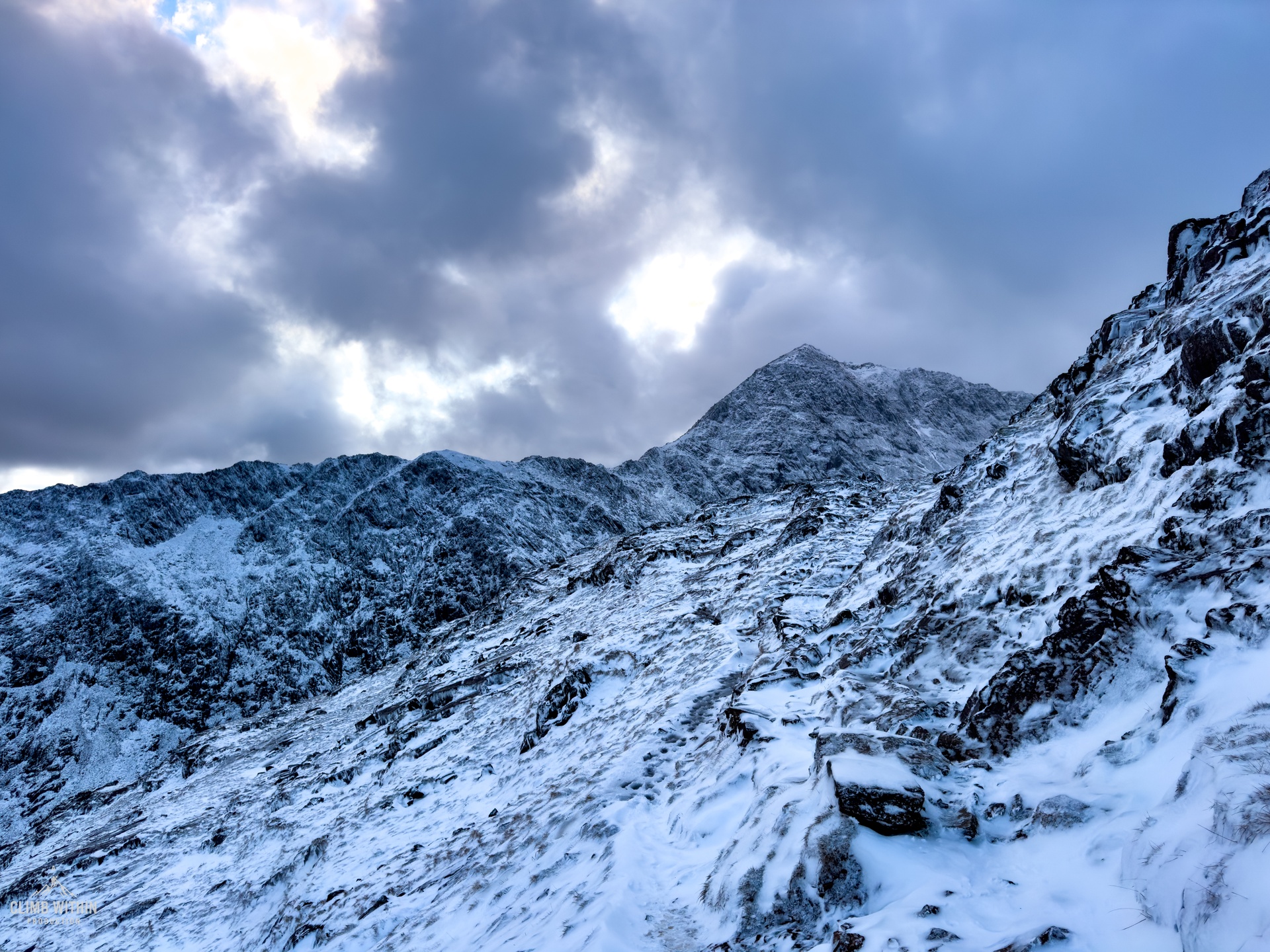 Winter mountain ridge with snow and clear sky