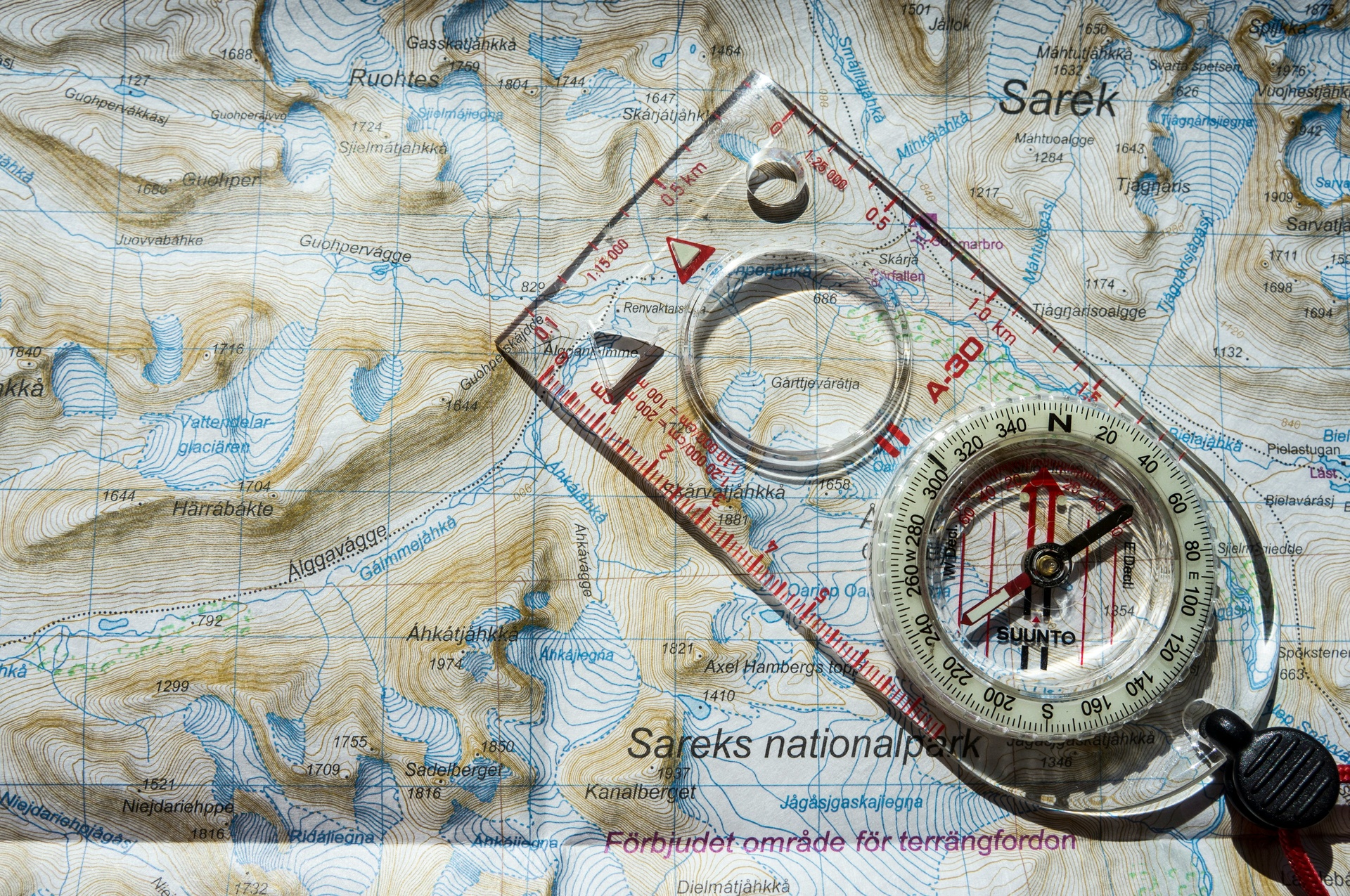 Navigating with a map and compass on a hillside